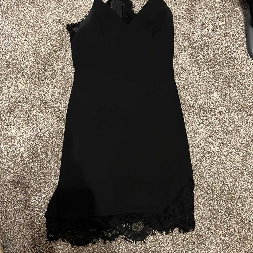 Short, tight black dress.